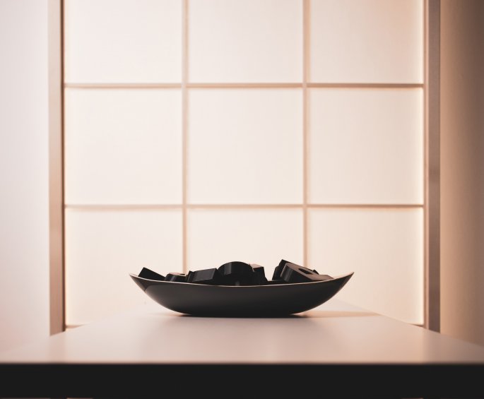 Filled Bowl On Table In Front Of Translucent Window