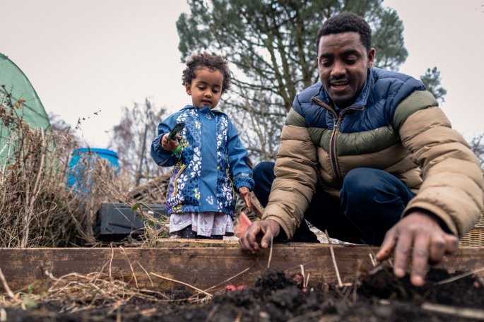 Father And Daughter Gardening