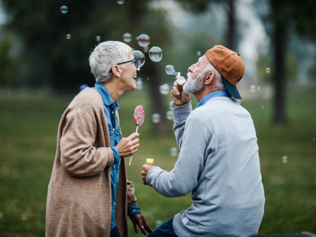 Elderly Couple Blowing Bubbles