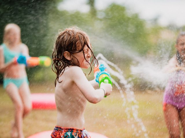 Children having a water fight